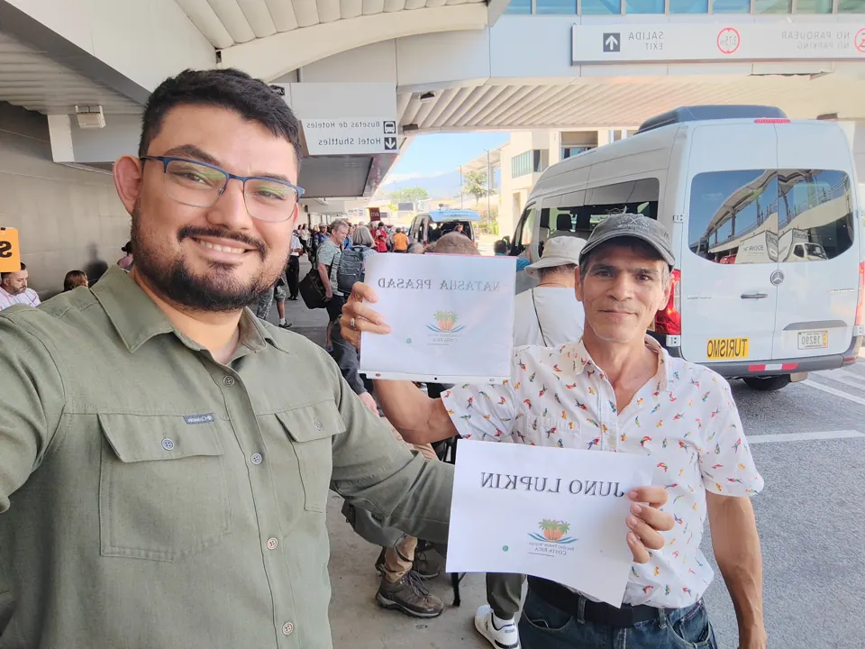 Airport pickup with the traveler's name on a sign