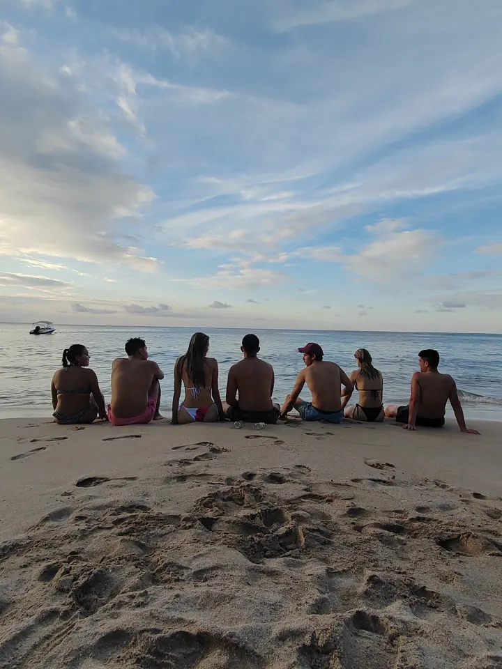 Group watching the sunset on the beach