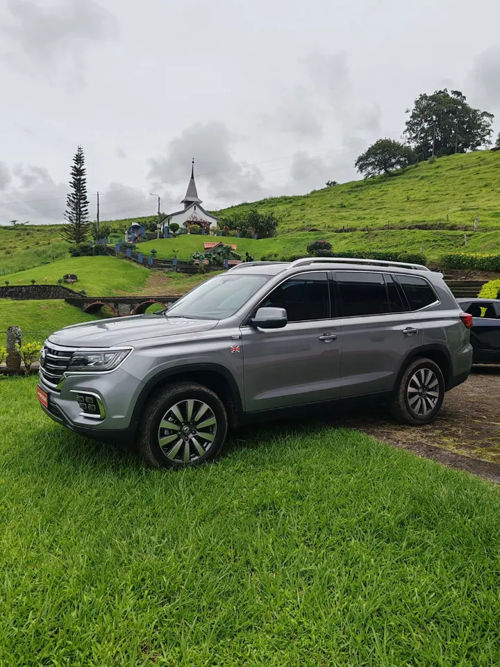 Private SUV on green Costa Rican hills